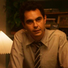 Max Minghella en el papel de John Borrelli