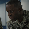Adrian Lester en el papel de Capitán Adam Spencer