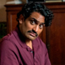 Sanjay Rao en el papel de Phil
