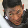 Hu Jun en el papel de Inspector Cao Nam