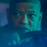 Laurence Fishburne en el papel de Fundi Romaine