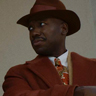 Lamorne Morris en el papel de Robbie Robertson